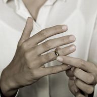 a lady removing her wedding ring