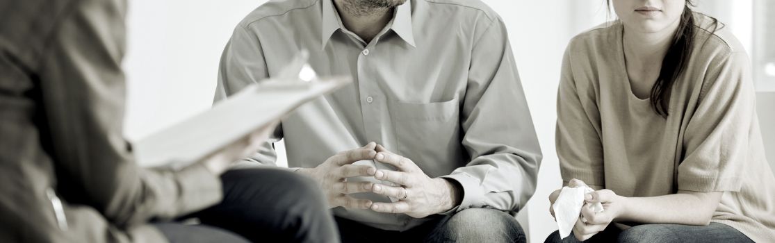 a couple talking to their mediator